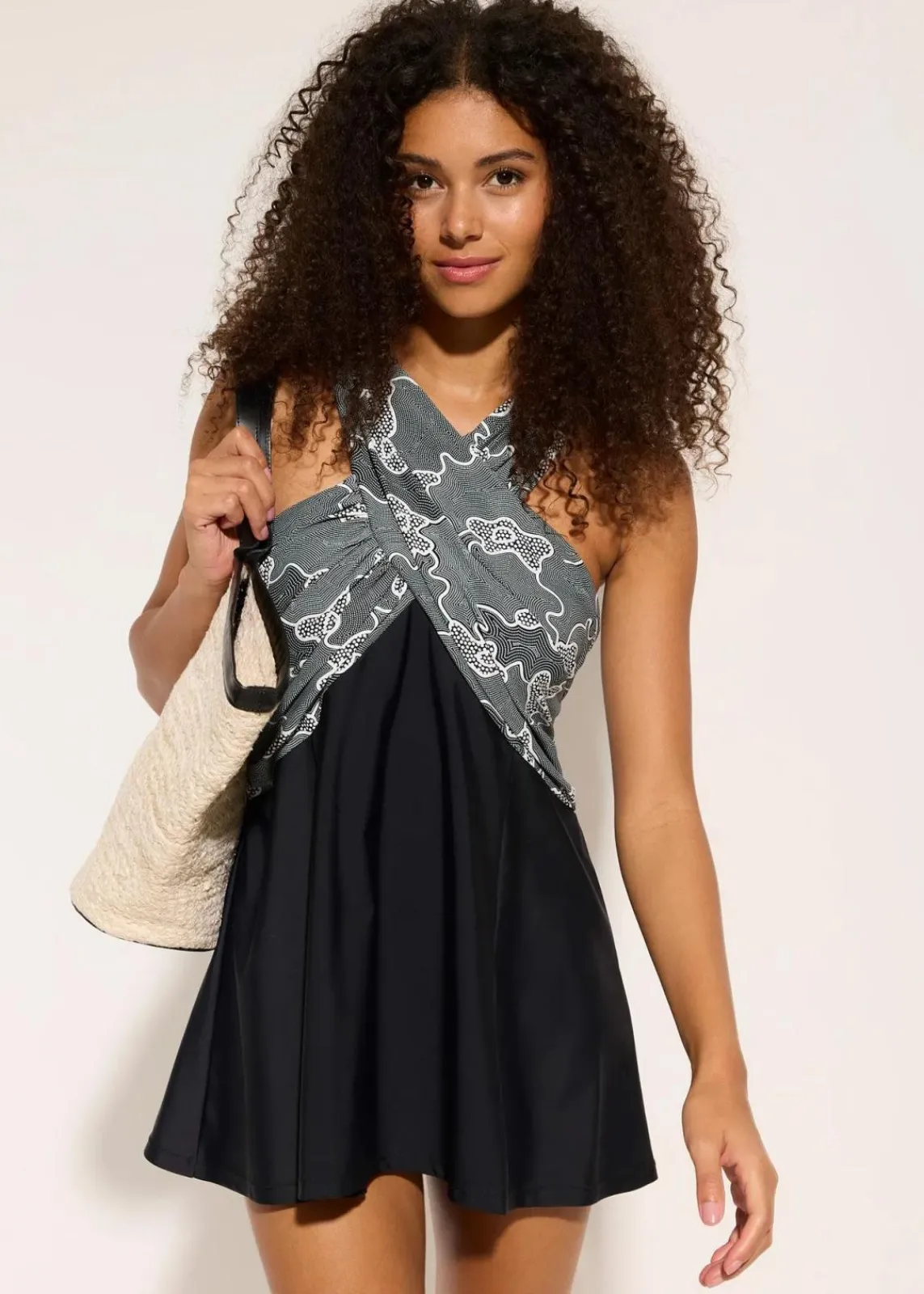 bonprix Nachhaltigere Materialien|Badekleider^Badekleid mit Wickel-Optik schwarz bedruckt