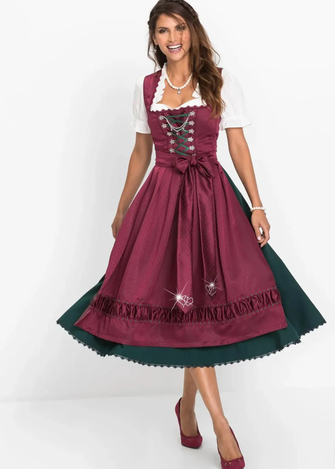 bonprix Kleider|Kurzgrößen^Dirndl mit bestickter Satin-Schürze (2-tlg.Set) magenta/tiefgrün/schwarz/mattviolett/wollweiß bedruckt