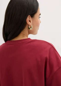 bonprix Shirts & Tops|Nachhaltigere Materialien^Kurzes T-Shirt aus reiner Bio-Baumwolle pflaumenrot leo bedruckt