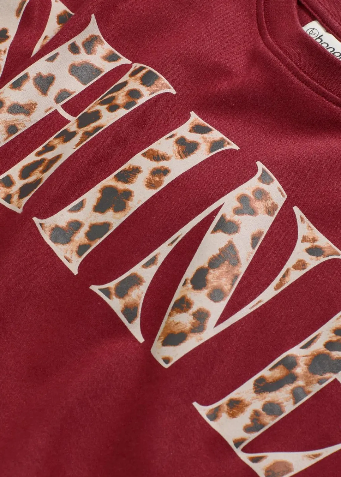 bonprix Shirts & Tops|Nachhaltigere Materialien^Kurzes T-Shirt aus reiner Bio-Baumwolle pflaumenrot leo bedruckt