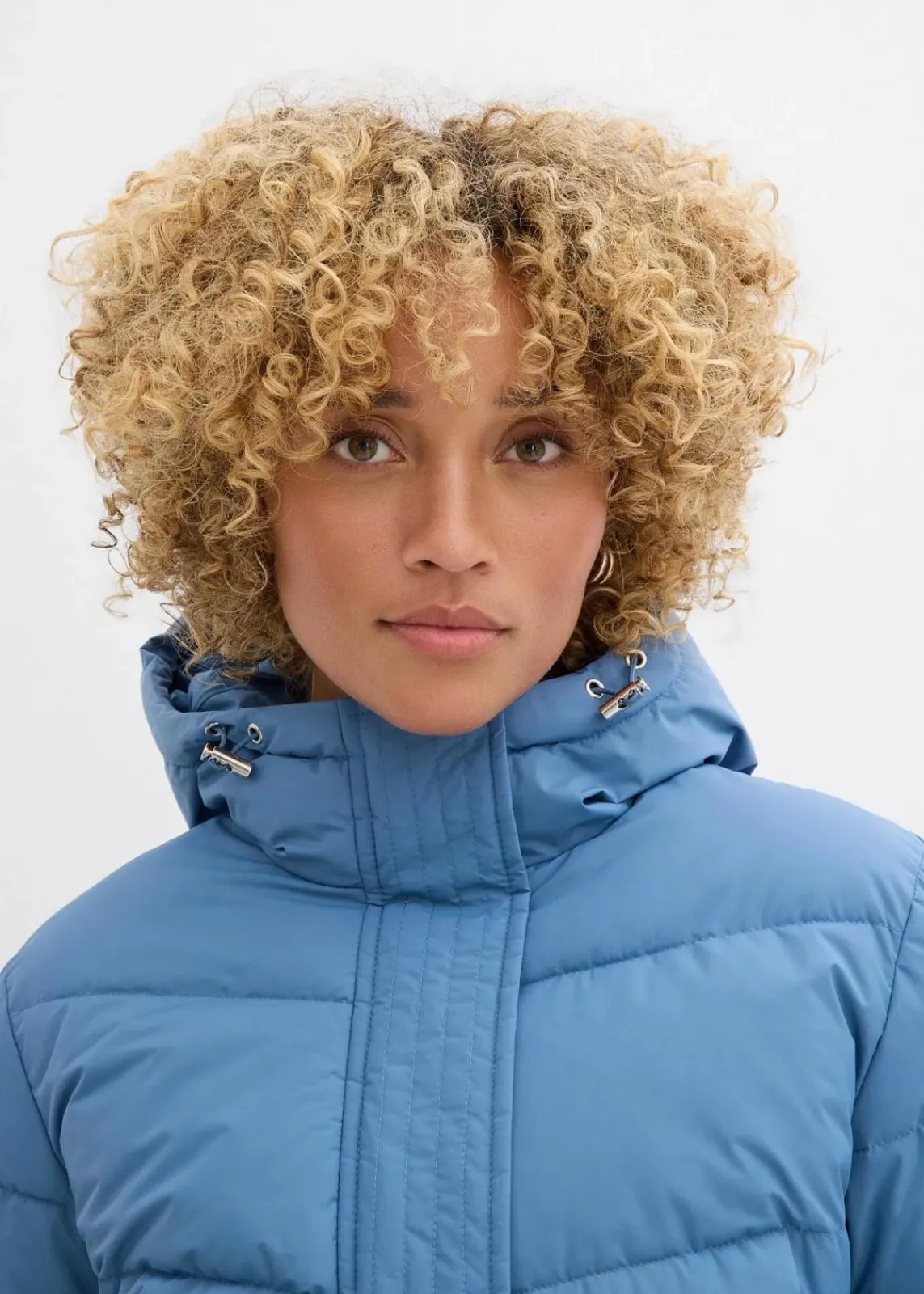 bonprix Jacken & Mäntel|Bekleidung·Hosen^Langer Stepp-Mantel mit Kapuze wellenblau