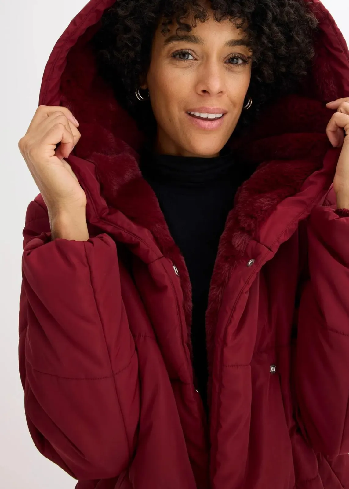 bonprix Jacken & Mäntel|Nachhaltigere Materialien^Steppjacke mit Fellimitatbesatz rubinrot