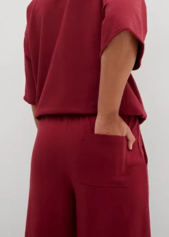 bonprix Hosen|Sweat^Sweathose aus Bio-Baumwolle, 7/8 Länge pflaumenrot