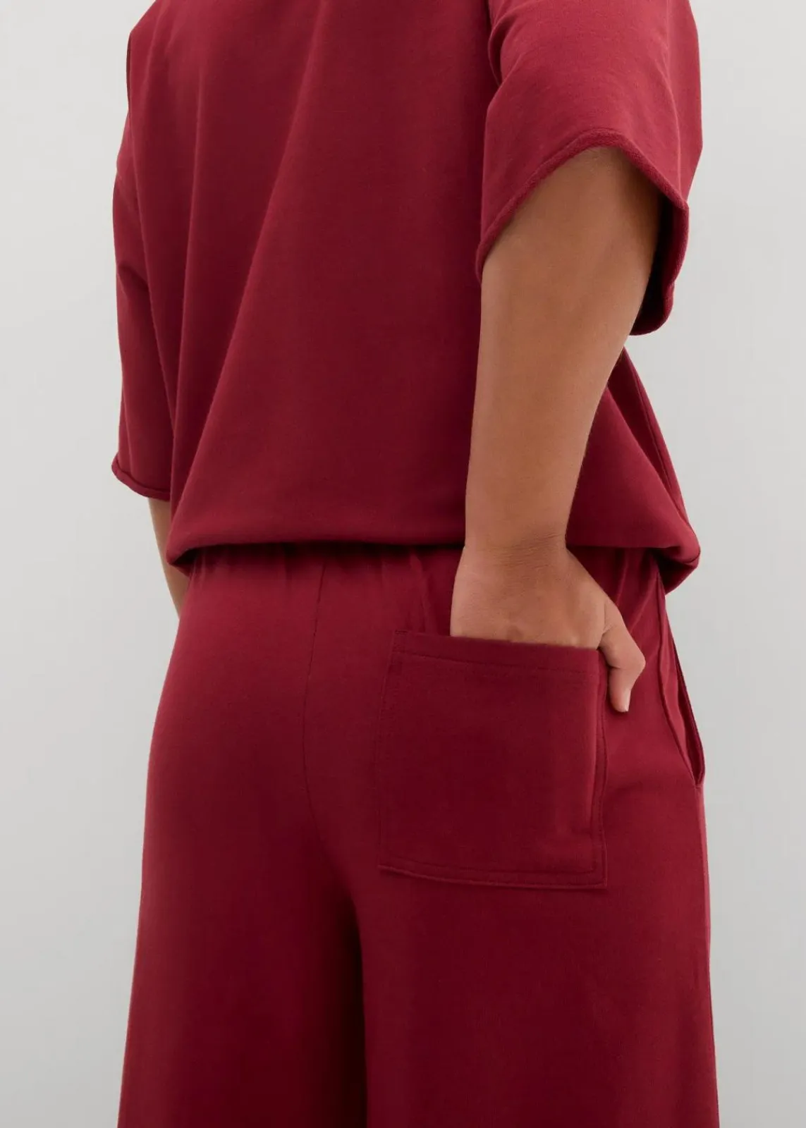 bonprix Hosen|Sweat^Sweathose aus Bio-Baumwolle, 7/8 Länge pflaumenrot