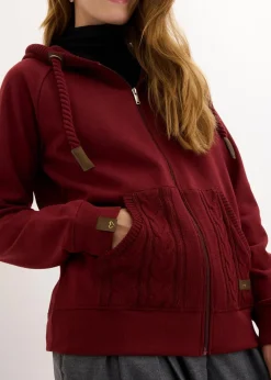 bonprix Sweat|Nachhaltigere Materialien^Sweatjacke mit Strickkapuze und Tasche rubinrot