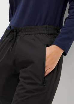 bonprix Bekleidung·Jumpsuits|Bekleidung·Sweat^Ultraleichte Schlupf-Regenhose mit seitlichem Reißverschluss, wasserdicht schwarz