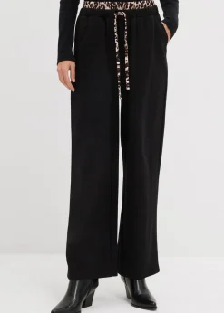 bonprix Bekleidung·Blusen & Tuniken|Bekleidung·Kleider^Weite Sweathose mit Kontrastbund schwarz leo bedruckt